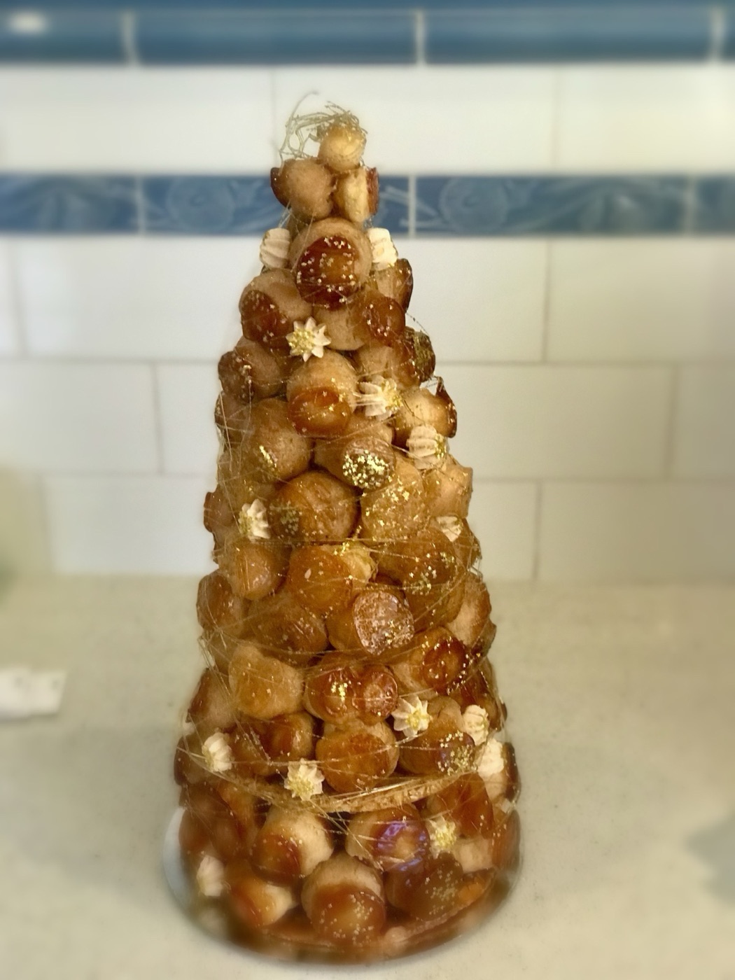 A croquembouche wrapped in spun sugar