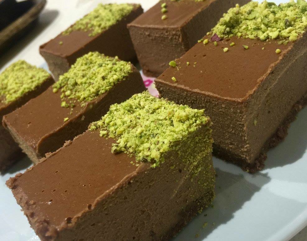 Chocolate slices scattered with crushed pistachio