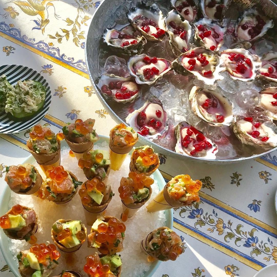 Fresh oysters and salmon tartare cones on crushed ice