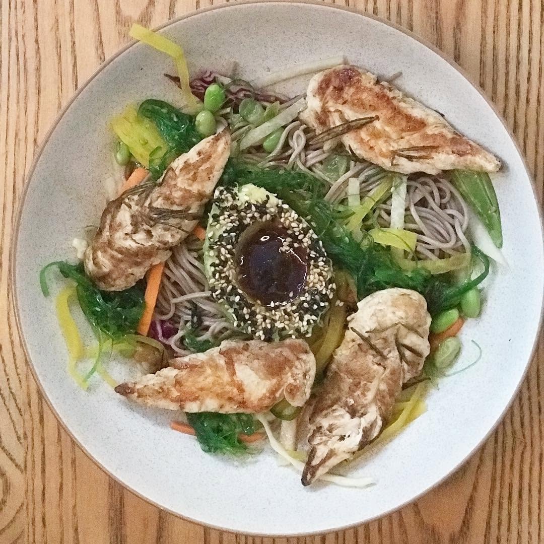A soba noodle bowl with grilled chicken, edamame and sesame dressing